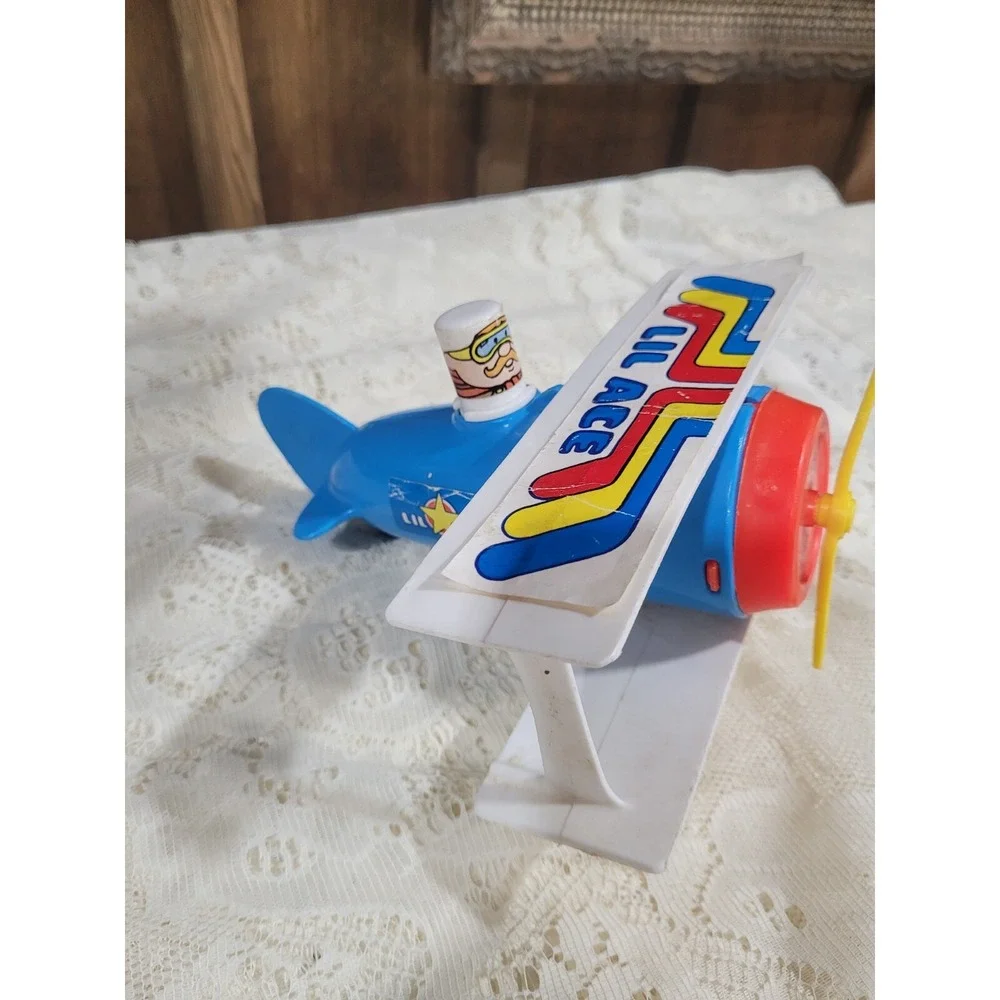 LIL ACE plastic airplane toy 1970s psychedelic stunt biplane w/ mustache man